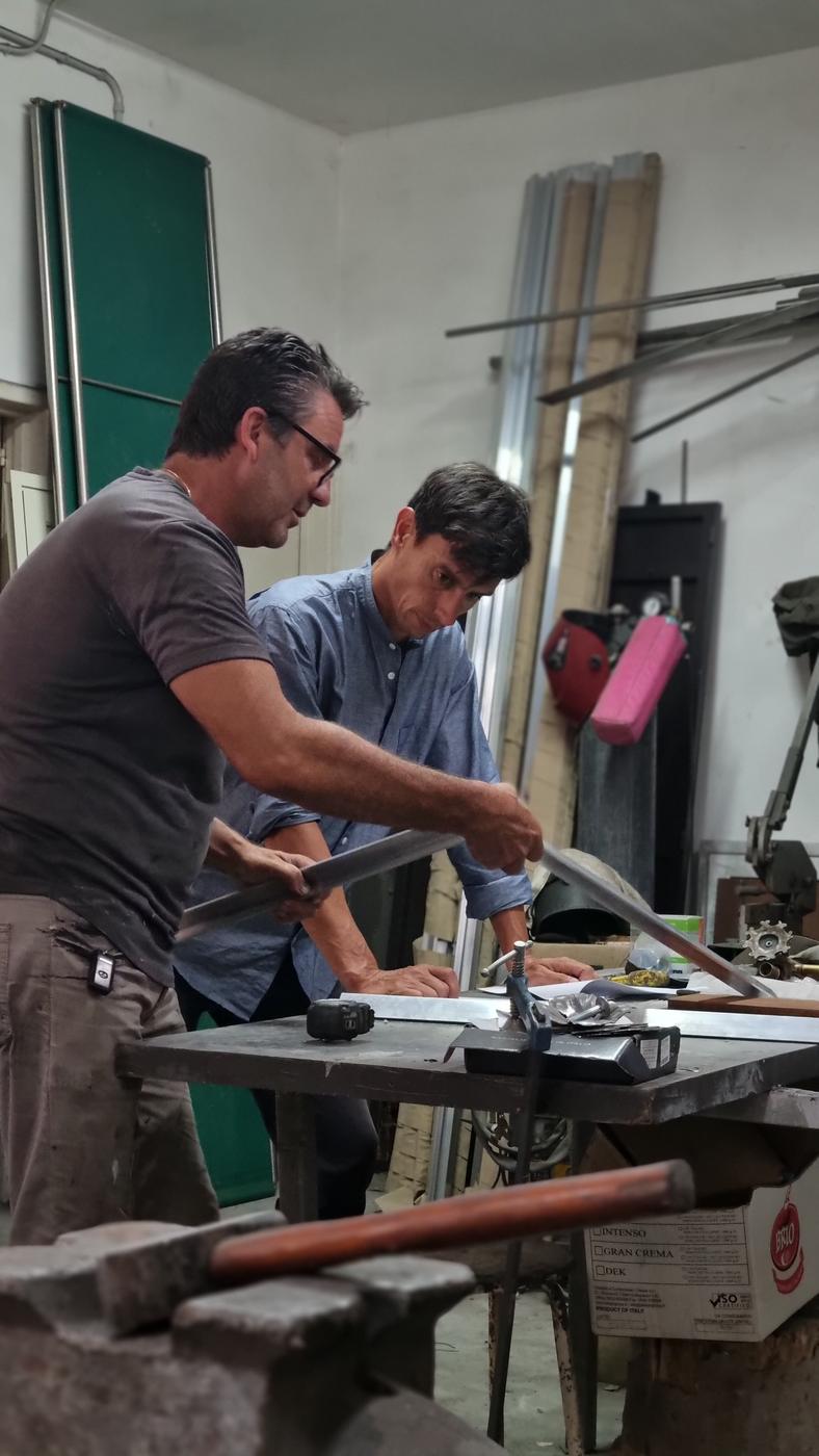 Giacomo Moor and Fedele Marra in the blacksmith's workshop